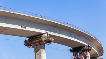 New Road Highway junction inter section entry exit ramp elevated  concrete moulded structure closeup section upward photograph .