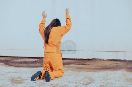 Prisoner in orange robe concept,Portrait of asian woman in Prison uniforms on white background,