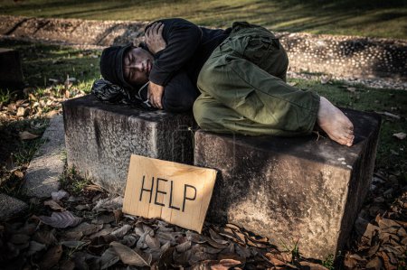 Photo for Asian man is homeless at the side road,A stranger has to live on the road alone because he has no family. - Royalty Free Image