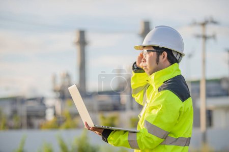 Photo for Asian man petrochemical engineer working at oil and gas refinery plant industry factory,The people worker man engineer work control at power plant energy industry manufacturing - Royalty Free Image