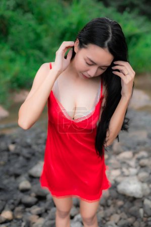 Photo for Portrait of sexy asian woman at the waterfall,Feeling fresh at the river,Thai female relax at country - Royalty Free Image