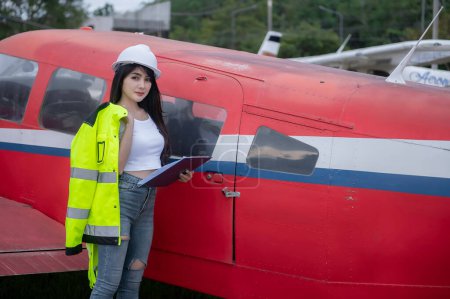 Photo for Technician fixing the engine of the airplane,Female aerospace engineering checking aircraft engines,Asian mechanic maintenance inspects plane engine - Royalty Free Image