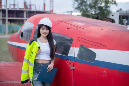Photo for Technician fixing the engine of the airplane,Female aerospace engineering checking aircraft engines,Asian mechanic maintenance inspects plane engine - Royalty Free Image