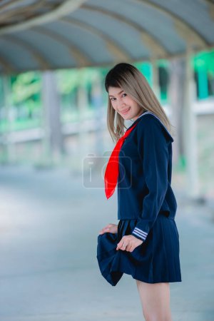 Photo for Portrait of asian woman wear student dress japan style,Thailand people,Cute girl pose for take a picture,Lifestyle of modern woman - Royalty Free Image