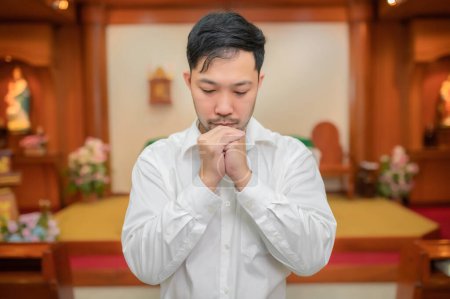 Photo for Christian man asking for blessings from God,Asian man praying to Jesus Christ - Royalty Free Image