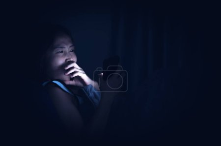 Photo for Asian woman play smartphone in the bed at night,Thailand people - Royalty Free Image
