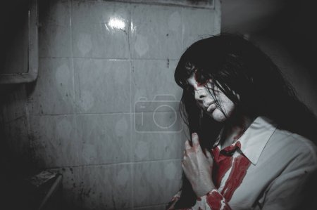 Photo for Portrait of asian woman make up ghost,Scary horror scene for background,Halloween festival concept,Ghost movies poster - Royalty Free Image