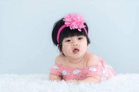 Photo for Portrait of cute asian baby on white carpet,Newborn smile for take a photo - Royalty Free Image