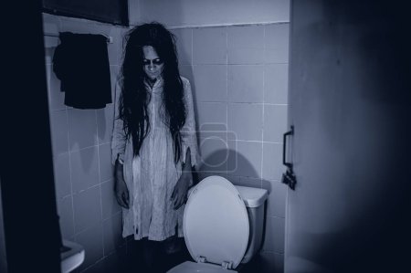 Photo for Portrait of asian woman make up ghost,Scary horror scene for background,Halloween festival concept,Ghost movies poster,angry spirit in the apartment - Royalty Free Image