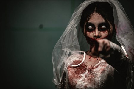 Photo for Halloween festival concept,Silhouette Asian woman makeup ghost face,Bride zombie charactor,Horror movie wallpaper or poster - Royalty Free Image
