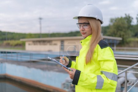 Photo for Environmental engineers work at wastewater treatment plants,Water supply engineering working at Water recycling plant for reuse - Royalty Free Image