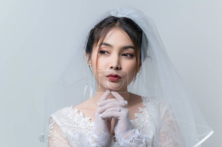 Foto de Portrait of asian woman wear bride with flower on white background,Wedding concept - Imagen libre de derechos