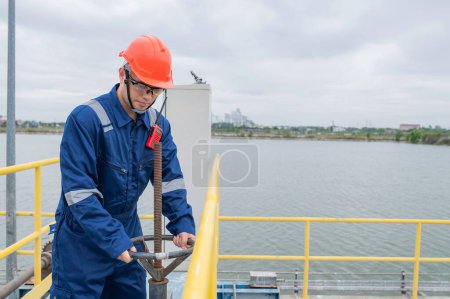 Photo for Water plant maintenance technicians, mechanical engineers check the control system at the water treatment plant. - Royalty Free Image