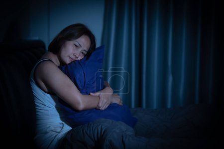 Photo for Asian women have a high concern that is why she can't sleep.Have stress from work - Royalty Free Image