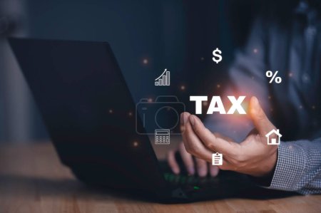 Photo for Concept of taxes paid by individuals,Tax with person using a laptop on the desk - Royalty Free Image