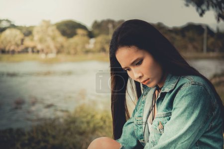 Photo for Beautiful thai woman very sad from unrequited love,rethink,think over,vintage style,dark tone,broken heart,asian girl - Royalty Free Image