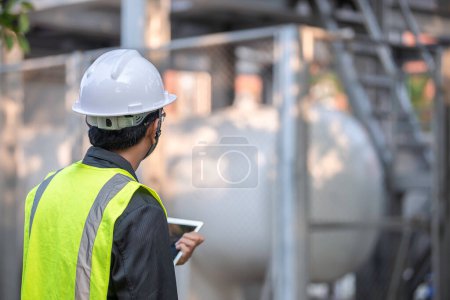 Photo for Engineers work place to keep liquid helium,preventive maintenance schedule checking,Thailand people - Royalty Free Image
