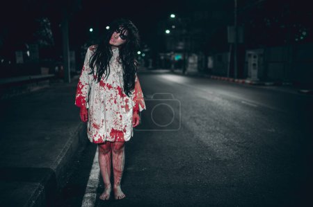 Photo for Horror woman concept. Ghost on the road in the city. A vengeful spirit on the street of the town. Halloween festival. Make up ghost face - Royalty Free Image