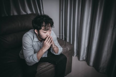 Photo for Asian handsome man stress from work overload. Tired male come back home after a lot of work from company, risk of depression - Royalty Free Image