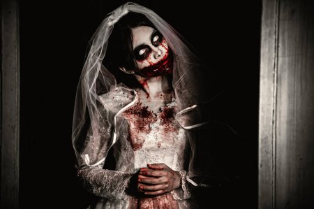 Photo for Halloween festival concept. Asian woman makeup ghost face. Bride zombie charactor. Horror movie wallpaper or poster - Royalty Free Image