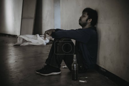 Photo for Asian men are drug addicts to inject heroin into their veins themselves. Flakka drug or zombie drug is dangerous life-threatening. Thailand no to drug concept. The bad guy drugs in the desolate - Royalty Free Image