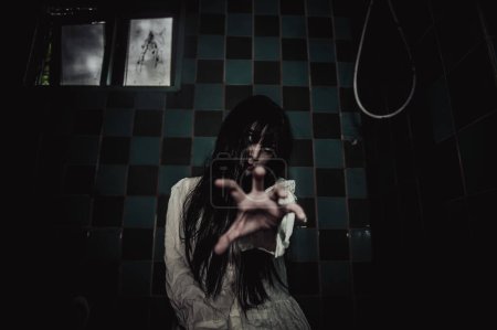 Photo for Portrait of asian woman make up ghost. Scary horror scene for background. Halloween festival concept. Ghost movies poster - Royalty Free Image