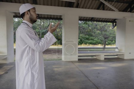 Photo for Asian islam man prayer. Young Muslim praying. Ramadan festival concept - Royalty Free Image