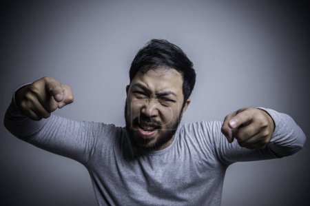 Photo for Asian handsome man angry on white background, Portrait of young stress male concept. Bad mood after talking on the phone - Royalty Free Image