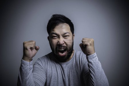 Photo for Asian handsome man angry on white background, Portrait of young stress male concept. Bad mood after talking on the phone - Royalty Free Image