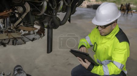 Photo for Technician fixing the engine of the airplane. Male aerospace engineering checking aircraft engines. Asian mechanic maintenance inspects plane engine - Royalty Free Image