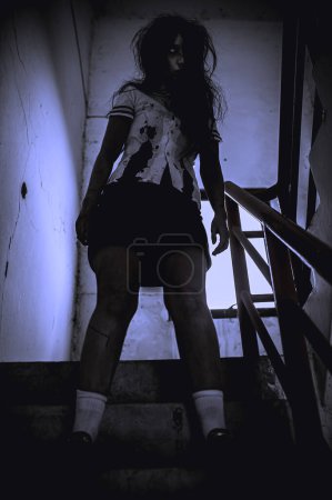 Photo for Portrait of asian woman make up ghost. Scary horror scene for background. Halloween festival concept. Ghost movies poster, angry spirit in the apartment - Royalty Free Image