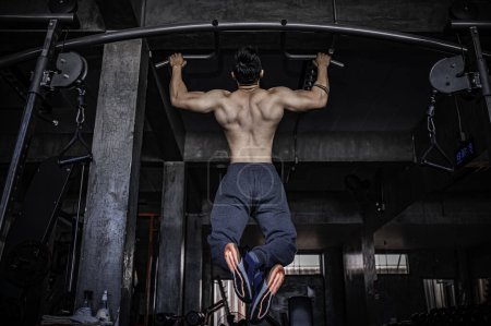 Photo for Portrait of asian man big muscle at the gym. Thailand people. Workout for good healthy. Body weight training. Fitness at the gym concept. Asian man exercise chest muscle workout - Royalty Free Image