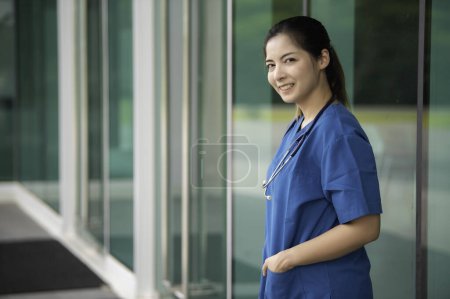 Photo for Young asian nurse working in clinic. Portrait of doctor in a hospital - Royalty Free Image