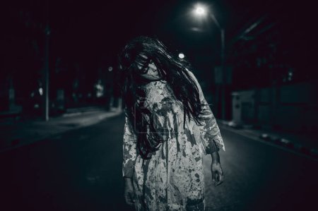 Photo for Horror woman concept. Ghost on the road in the city. A vengeful spirit on the street of the town. Halloween festival. Make up ghost face - Royalty Free Image