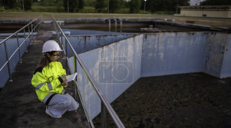 Photo for Environmental engineer work at wastewater treatment plants. Water supply engineering working at Water recycling plant for reuse - Royalty Free Image