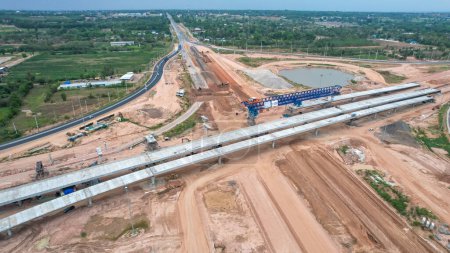 Photo for View from drone of A large bridge is under construction. Expanding roads outside the city to increase traffic lanes - Royalty Free Image