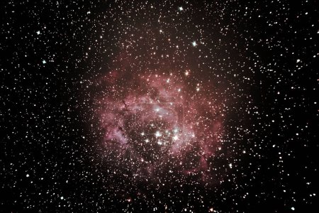 Photo for Rosette Nebula is a large and circular H II region, located on the edge of a gigantic molecular cloud in the constellation of the Unicorn Monoceros, located in the band of the Milky Way. - Royalty Free Image