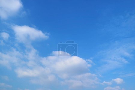 Photo for Pure White Clouds Floating on Vibrant Blue Sky - Royalty Free Image