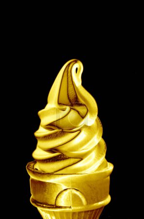 Photo for Pop Art Styled Metallic Gold Soft Serve Ice Cream Cone Isolated on Black Backdrop - Royalty Free Image