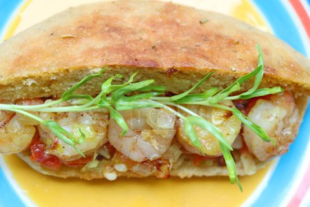 Foto de Closeup of Mouthwatering Herbed Bread Po Boy Sandwich with Freshly Harvest Water Spinach Microgreens - Imagen libre de derechos