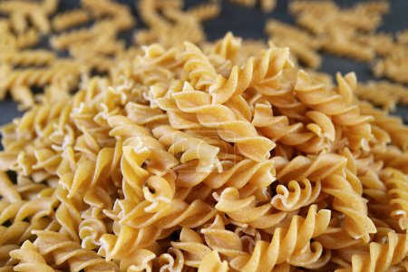 Photo for Pile of Uncooked Dried Whole Wheat Fusilli Pasta - Royalty Free Image