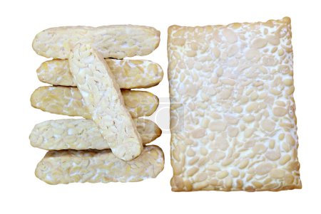 Whole and Sliced Fresh Tempeh, a High Plant Protein Source Isolated on white backdrop