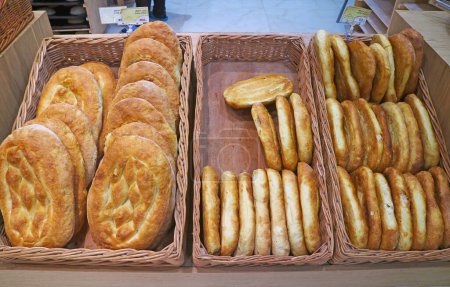Photo for Baskets of Armenian traditional breads for sale in a local bakery shop - Royalty Free Image