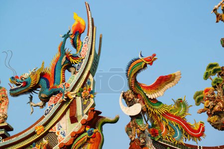 Photo for Fantastic Details of the Ornate Roofs of Sian Lo Tai Tian Kong Chinese Buddhist Temple in Samut Prakan Province, Thailand - Royalty Free Image