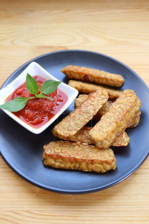 Pan fried Tempeh with homemade marinara sauce, a healthy and tasty dish of whole foods plant based diet