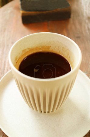 Cup of Hot Black Coffee Isolated on Wooden Table