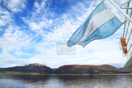 Photo for Argentine flag of a cruise ship waving in the sunlight, Beagle channel, Ushuaia, Argentina, South America - Royalty Free Image