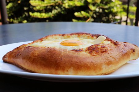 Plate of Delectable, Adjarian Khachapuri, a Cheese and Egg Filled Traditional Georgian Bread