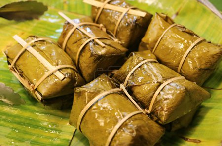 Thai Steamed Sweetened Sticky Rice with Filling Wrapped in Banana Leaf Called Khao Tom Mud