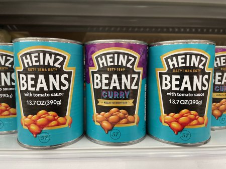 Photo for Indianapolis - Circa November 2022: Heinz Beans with tomato sauce and curry. Heinz baked beans have been a food staple since 1886. - Royalty Free Image
